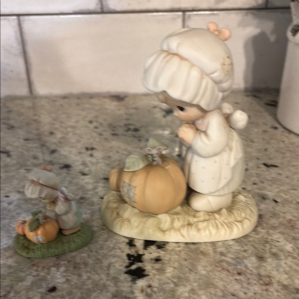 Precious Moments Cream and Orange Figurine Set